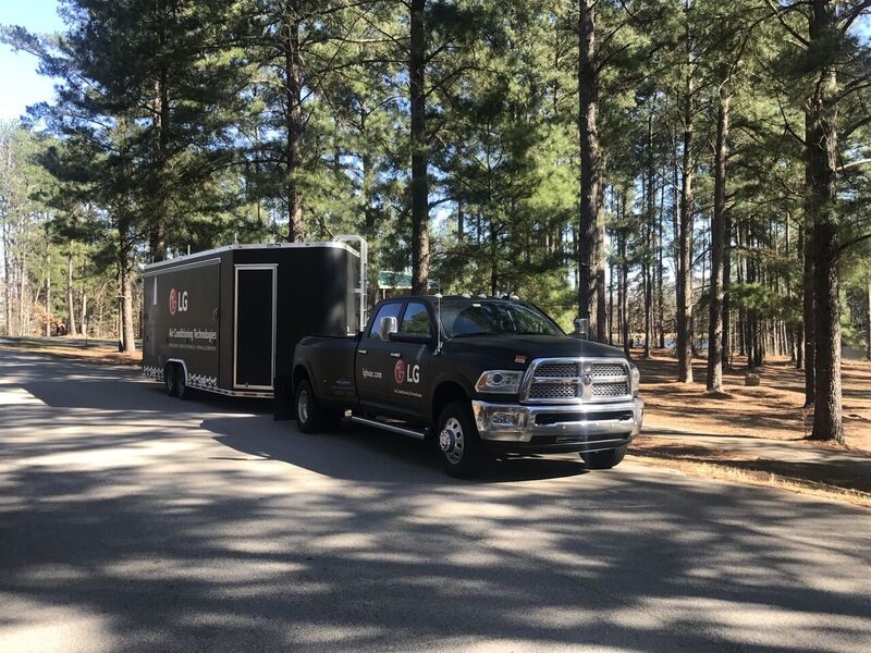 Black LG truck and trailer