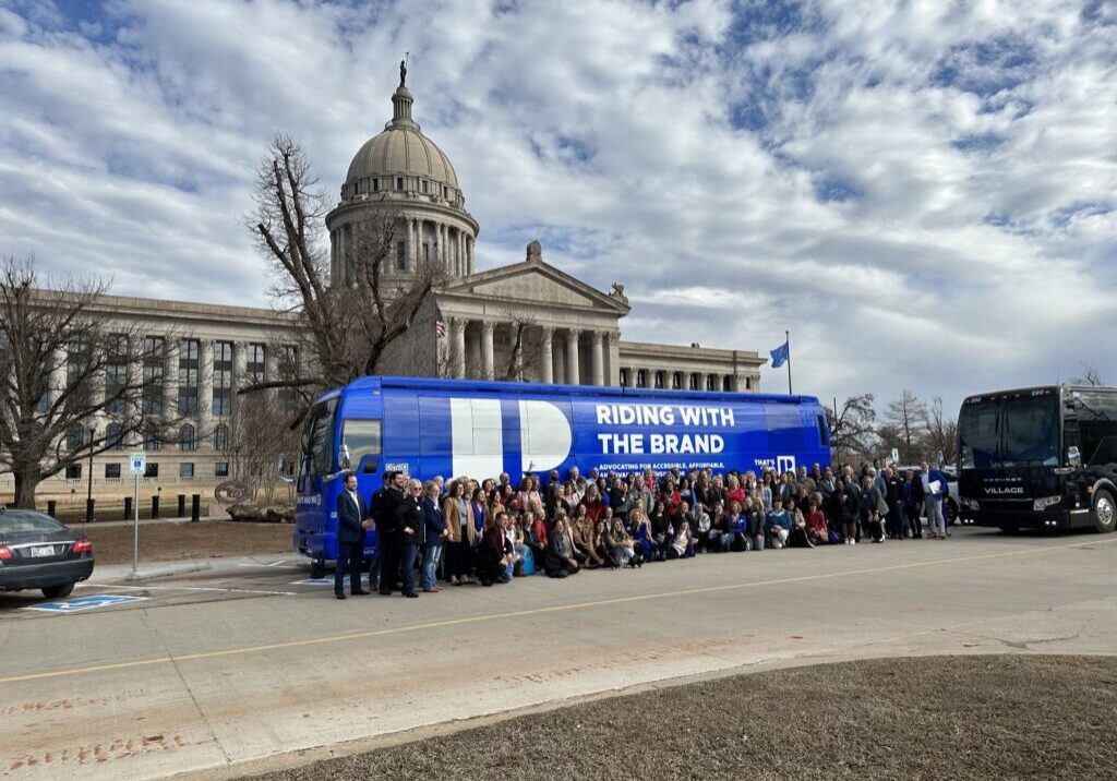 Group of people gathered in front of a of a BMG designed truck for the National Association of REALTORS®